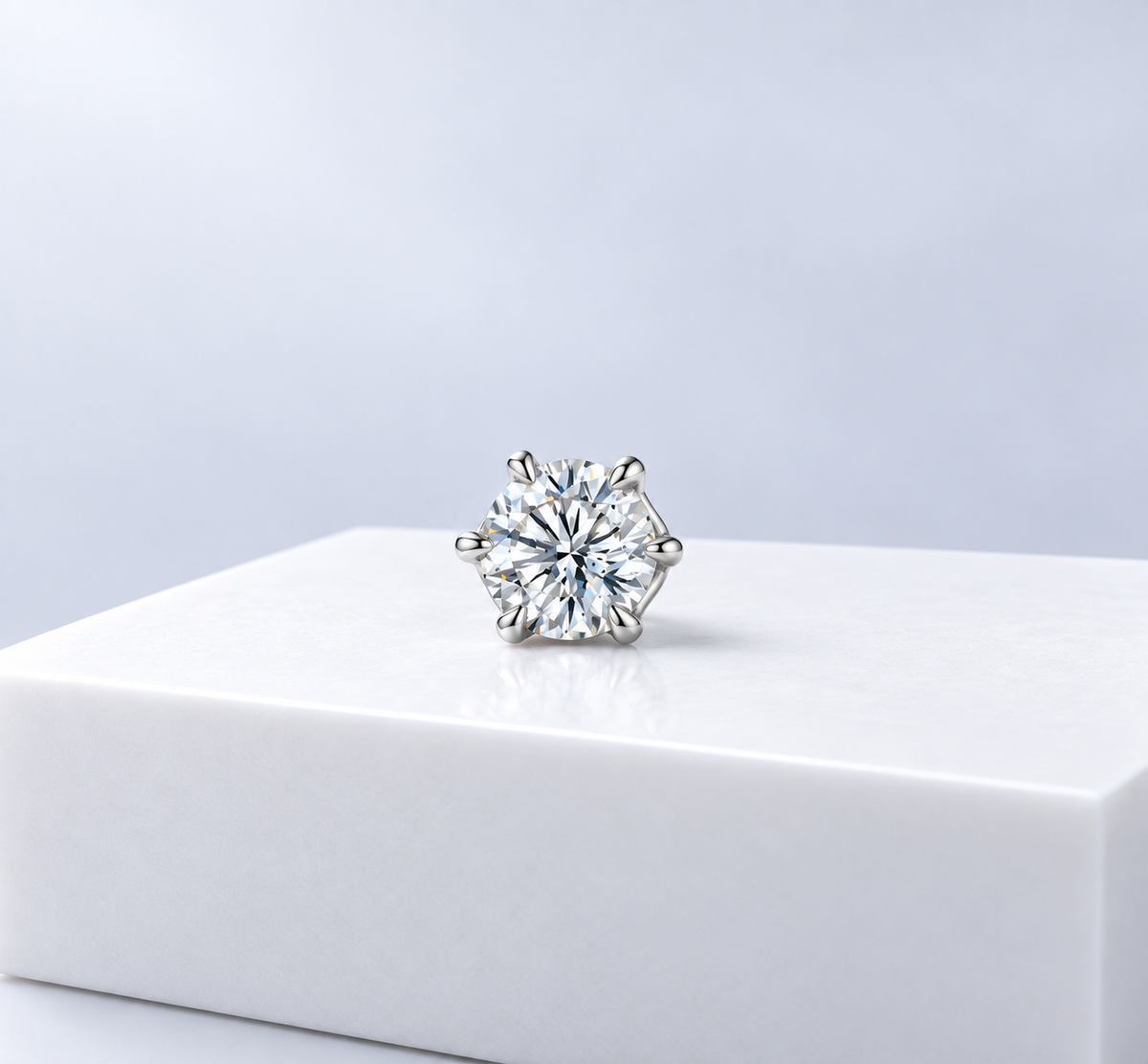 Noor solitaire stud, a round brilliant stone in a screw-back earring.