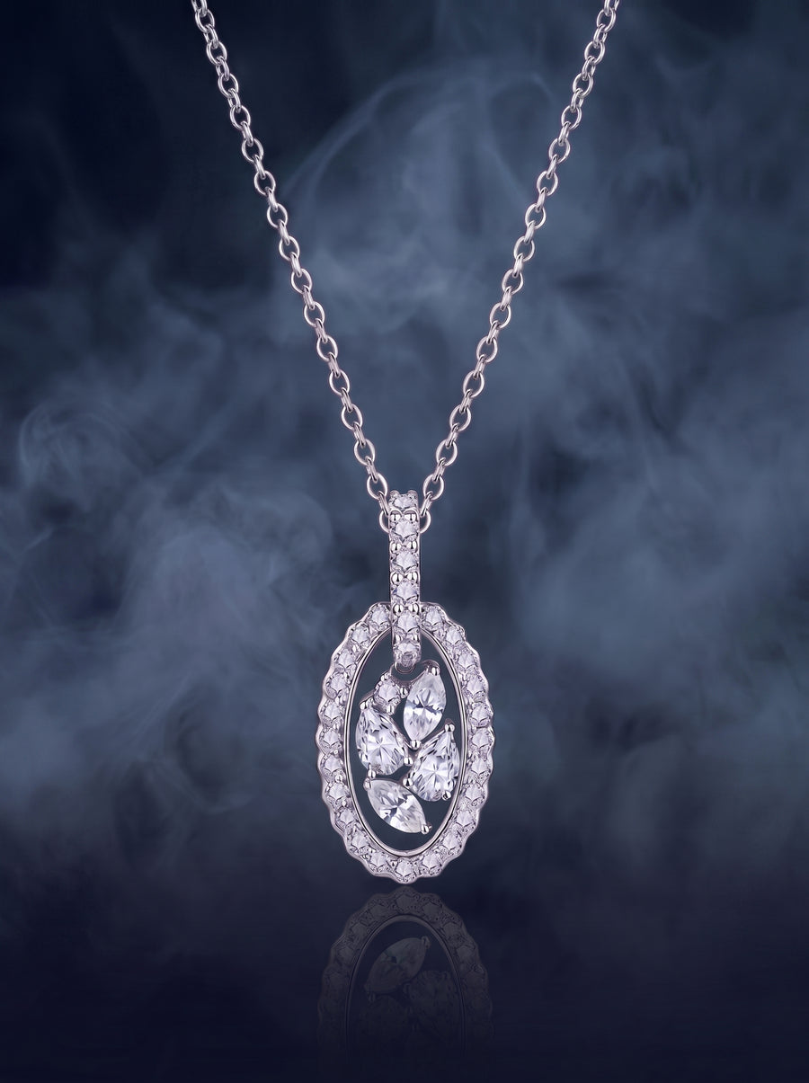 Meridian pendant, an oval silver halo pendant with a cluster of marquise-cut stones at the center, on a fine cable chain.