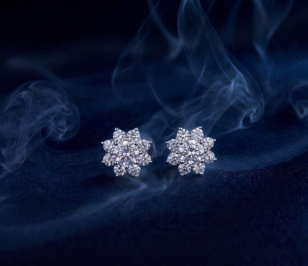 Nova studs, a pair of floral halo stud earrings made of round stones forming a blossom shape.