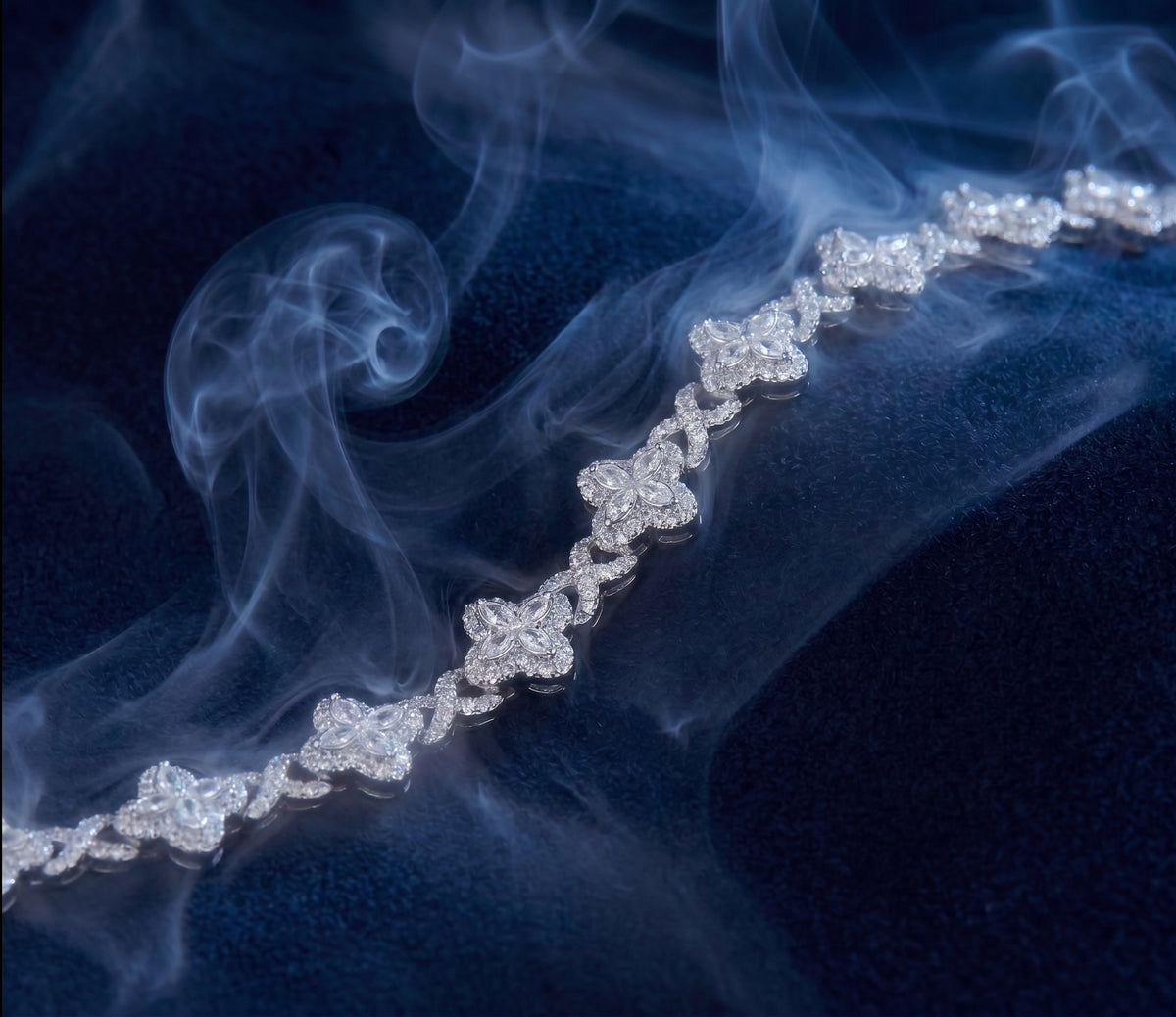 Camellia bracelet, a silver line bracelet with floral clusters of marquise-cut stones joined by twisted pavé links.