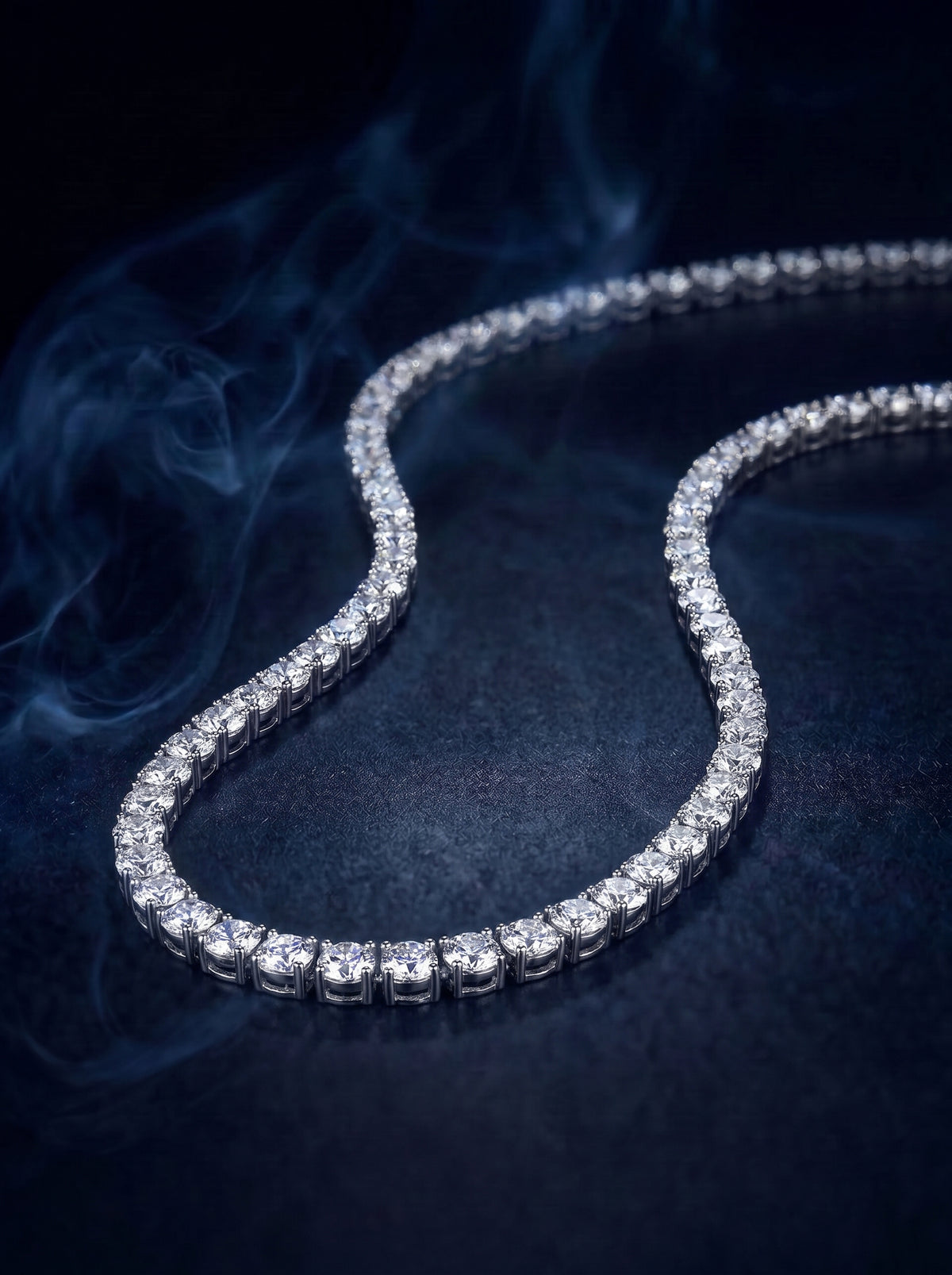 Aurelian tennis necklace, a continuous line of round stones in a classic tennis setting, on a silver chain with a clasp.