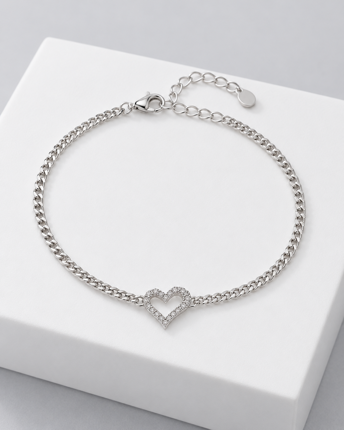 Colette heart bracelet, a curb chain bracelet with a pavé heart charm.