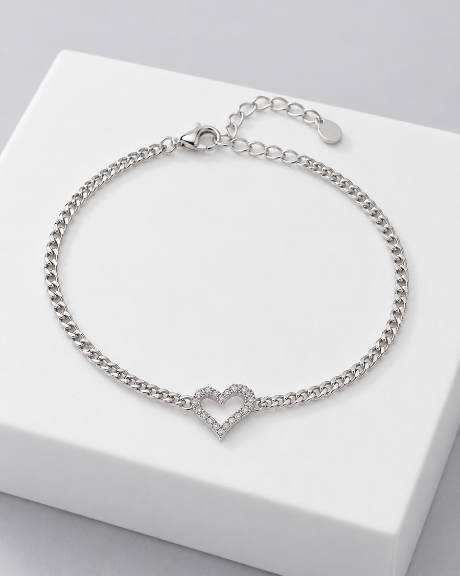 Colette heart bracelet, a curb chain bracelet with a pavé heart charm.