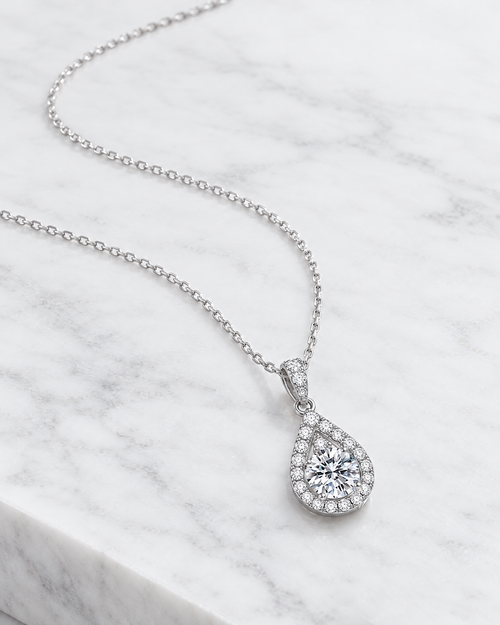 Amora heart pendant from an angle, showing the open heart outline.