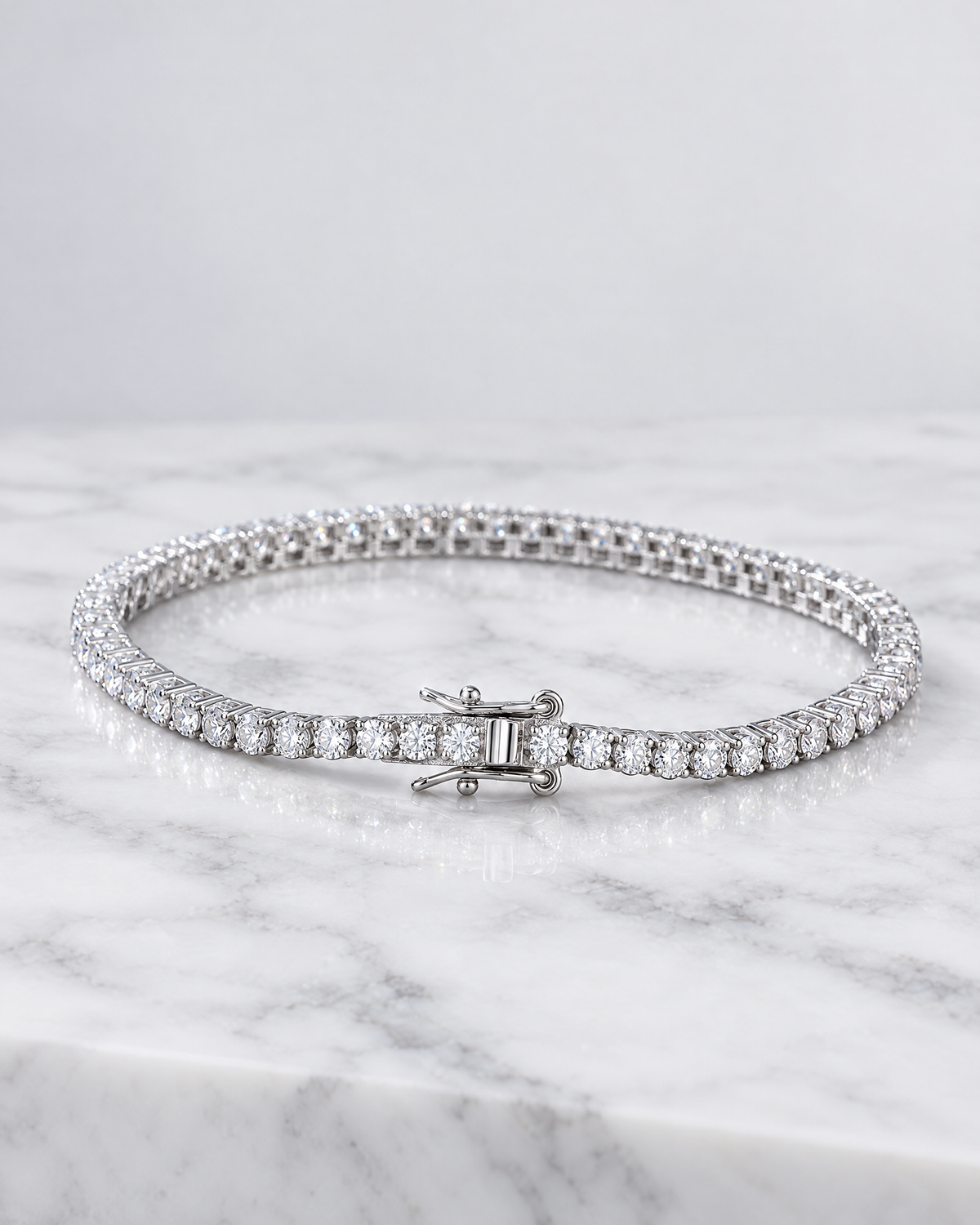 Aurelian tennis bracelet laid flat, showing the full line of stones and the clasp.