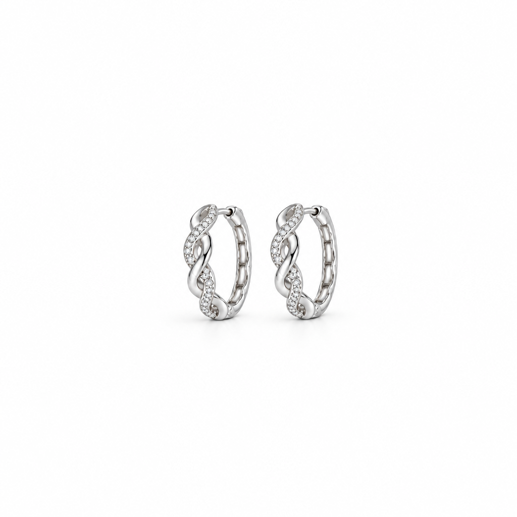 Wide editorial photo of a pair of Elara twist hoops.