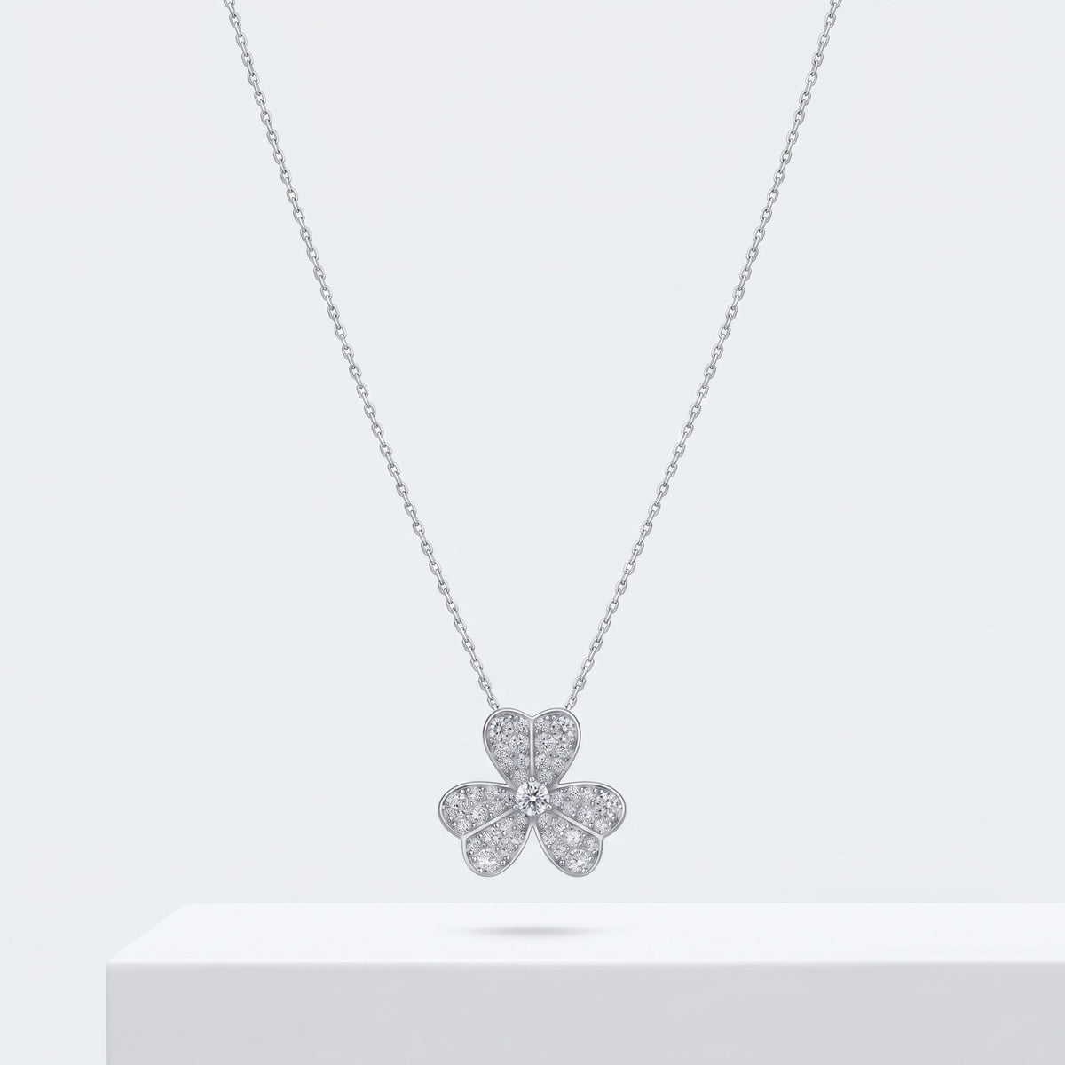 Odette clover pendant, a clover pendant necklace set with stones, on a fine cable chain.